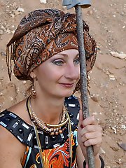 With spear wearing in colorful dress