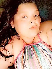 The woman is posing naked for a photo session